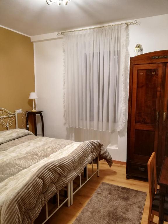 Postel nebo postele na pokoji v ubytování Appartamento Collini
