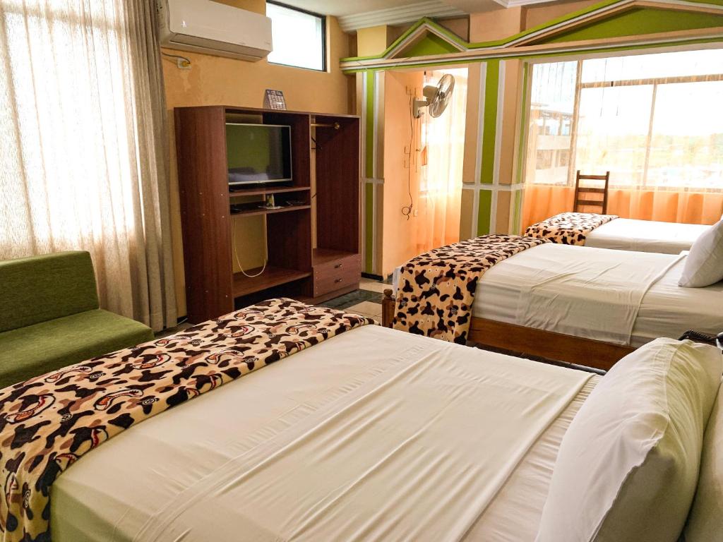 Postel nebo postele na pokoji v ubytování Hotel Somagg