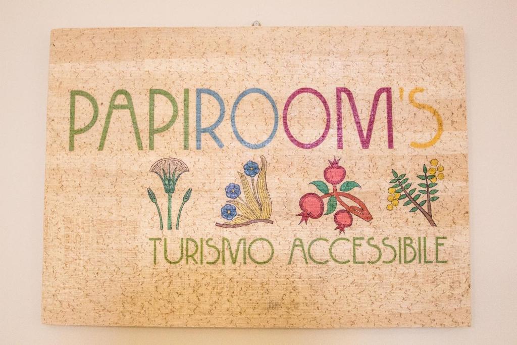 un signo con las palabras Riponia y hortalizas en Papiroom's, en Siracusa