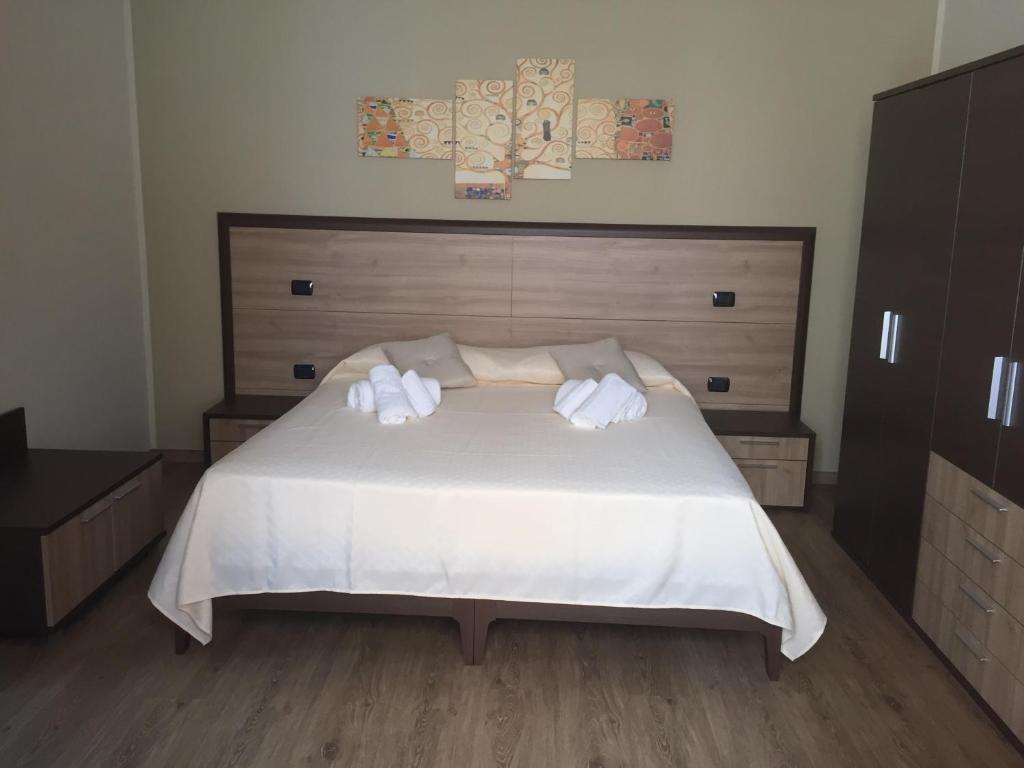 Postel nebo postele na pokoji v ubytování B&B Duomo Pizzo ApartHotel