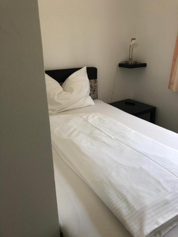 Postel nebo postele na pokoji v ubytování Fremdenzimmer& Appartementhaus Blassnig