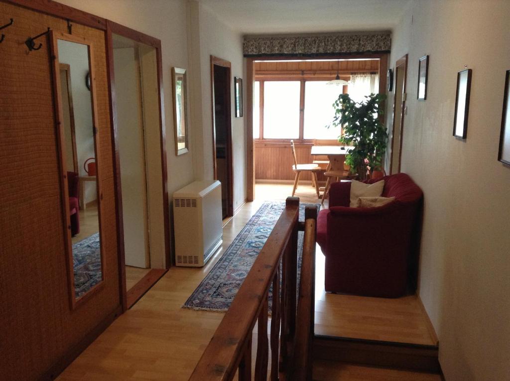 a hallway with a living room and a dining room at Appartements direkt am See in Grundlsee