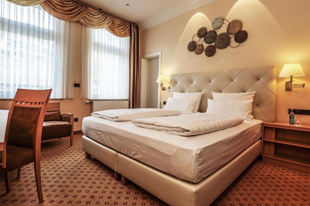Postel nebo postele na pokoji v ubytování Hotel Mack Private Inn