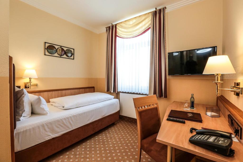 Postel nebo postele na pokoji v ubytování Hotel Mack Private Inn