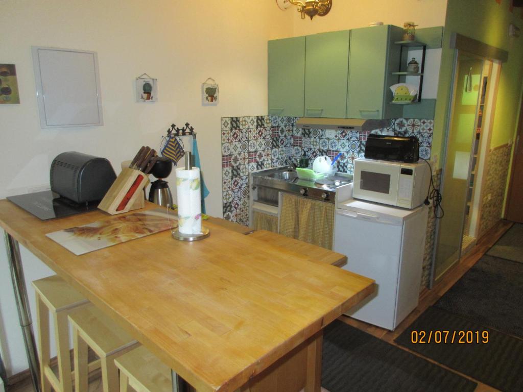 Kuchyň nebo kuchyňský kout v ubytování La Muria Apartment