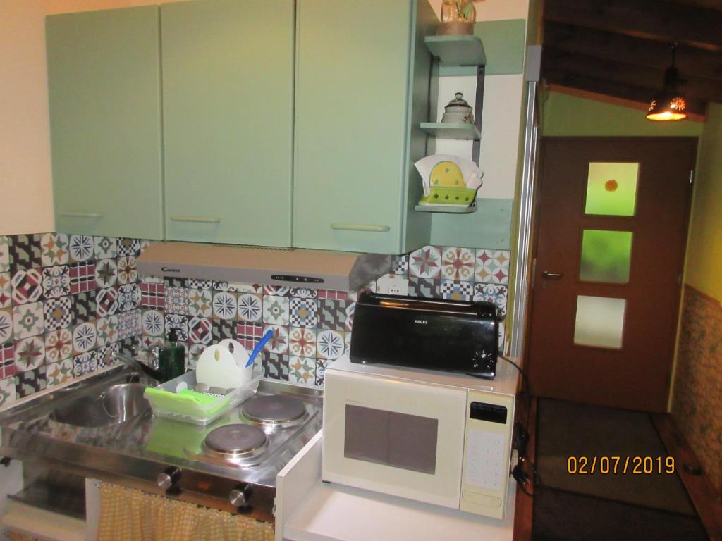 Kuchyň nebo kuchyňský kout v ubytování La Muria Apartment