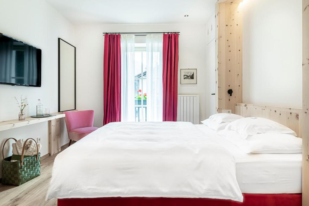 Postel nebo postele na pokoji v ubytování Hotel Drumlerhof