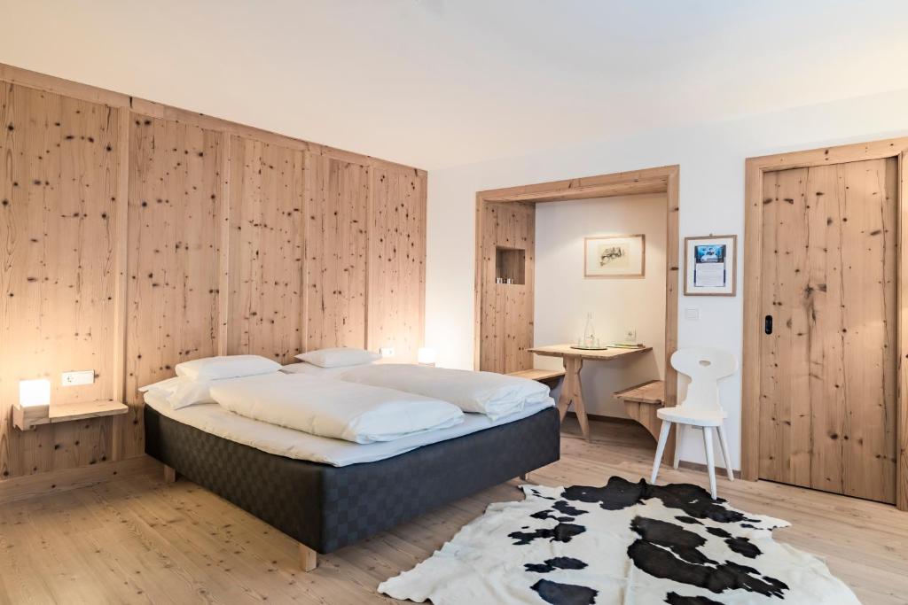 Postel nebo postele na pokoji v ubytování Hotel Drumlerhof