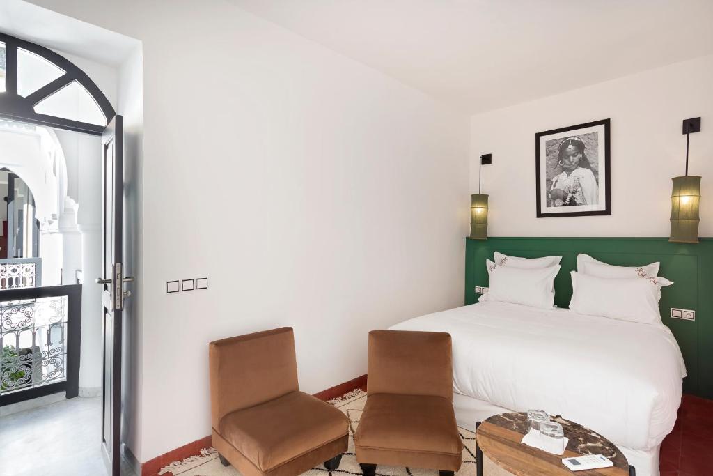 Postel nebo postele na pokoji v ubytování Riad Mirage