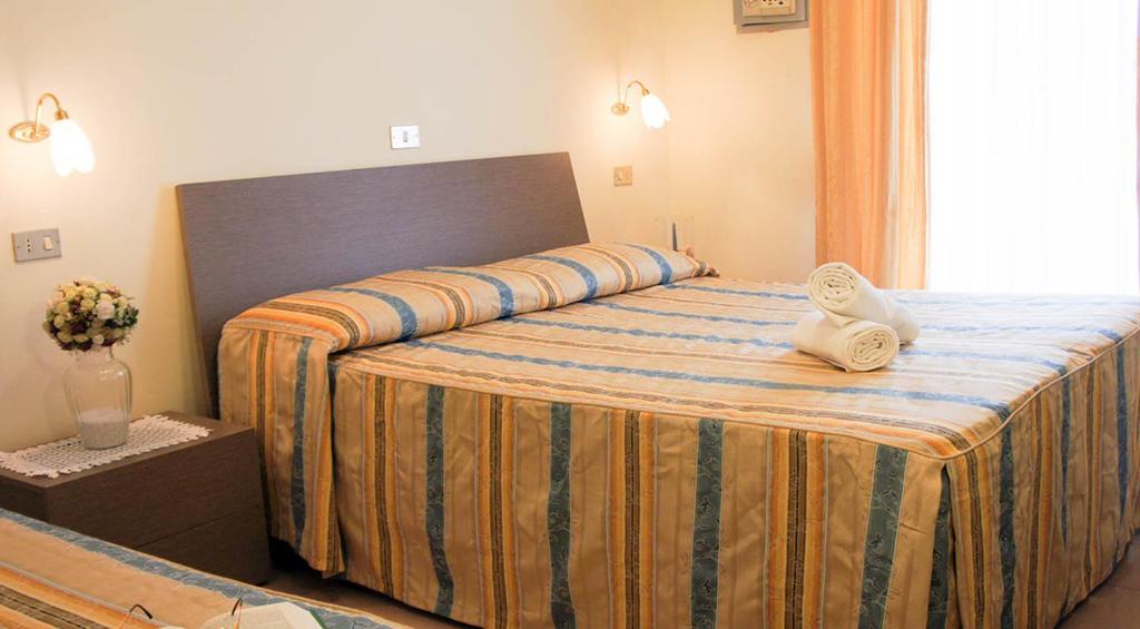 Letto o letti in una camera di Hotel Solaris