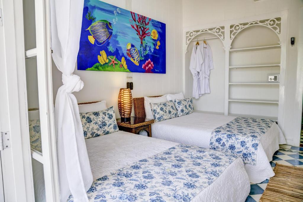 Postel nebo postele na pokoji v ubytování Hotel Agua Azul Beach Resort