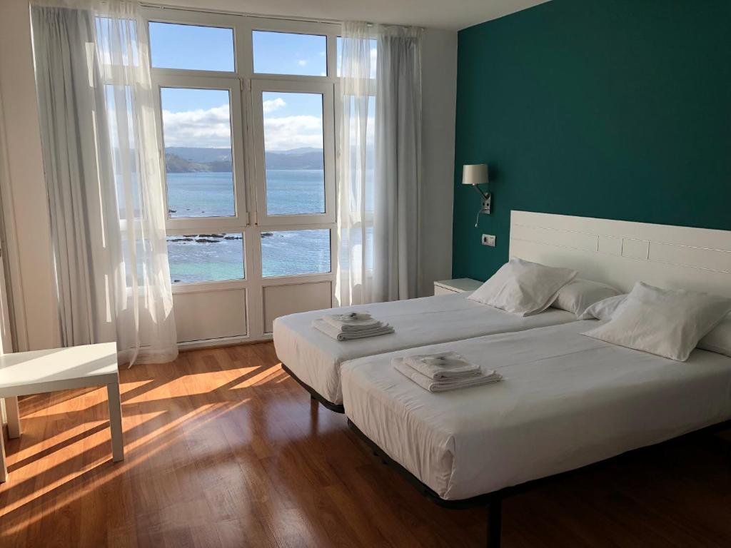 Cama o camas de una habitación en Hotel Mar de Fisterra