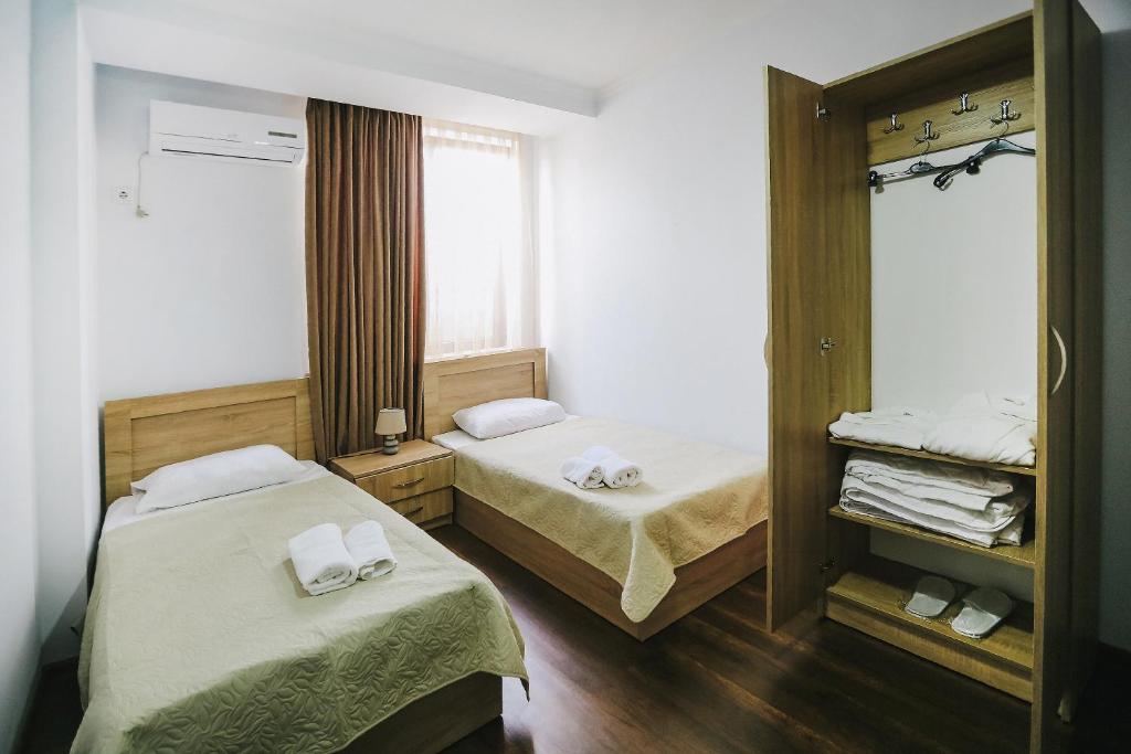 Postel nebo postele na pokoji v ubytování Balanchine