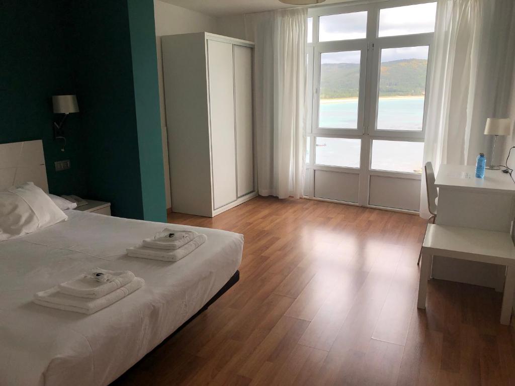 Cama o camas de una habitación en Hotel Mar de Fisterra