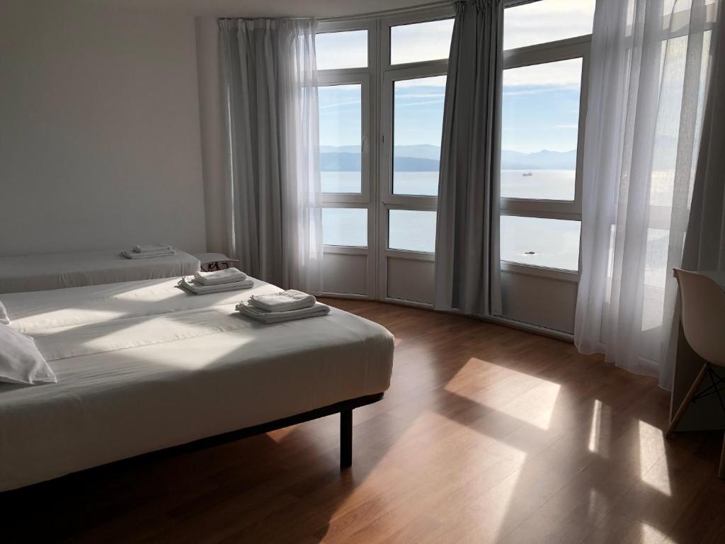 Cama o camas de una habitación en Hotel Mar de Fisterra
