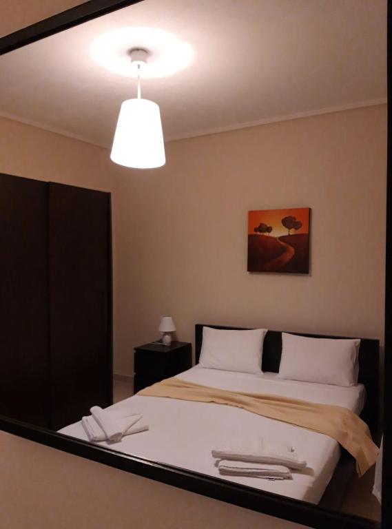 Postel nebo postele na pokoji v ubytování GOUGOUSIS apartments