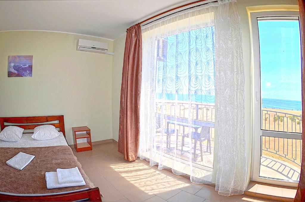 Postel nebo postele na pokoji v ubytování Hotel Golden Beach