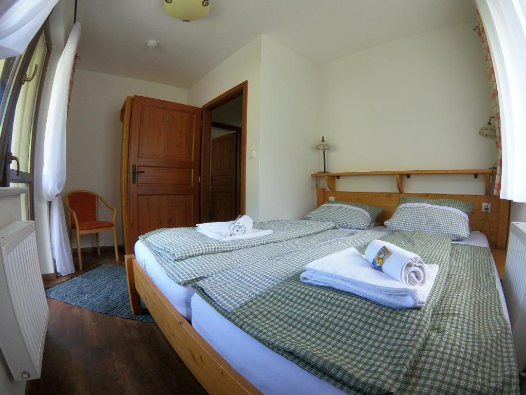 Postel nebo postele na pokoji v ubytování Pension Gemshorn