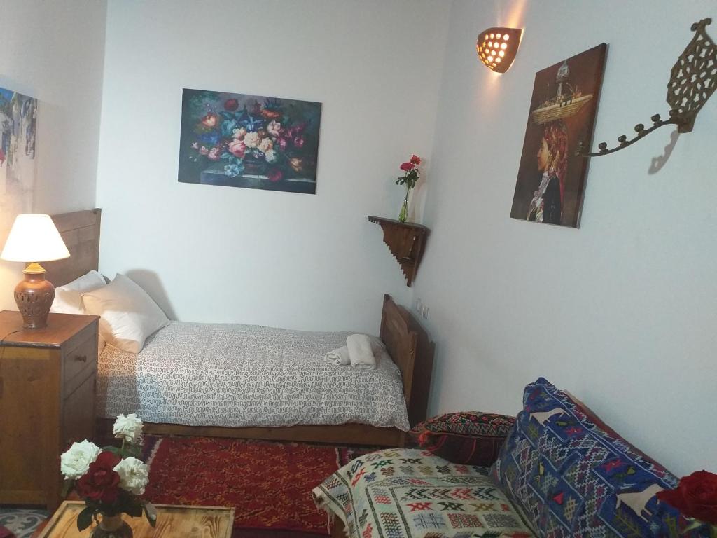 Postel nebo postele na pokoji v ubytování Dar Halima