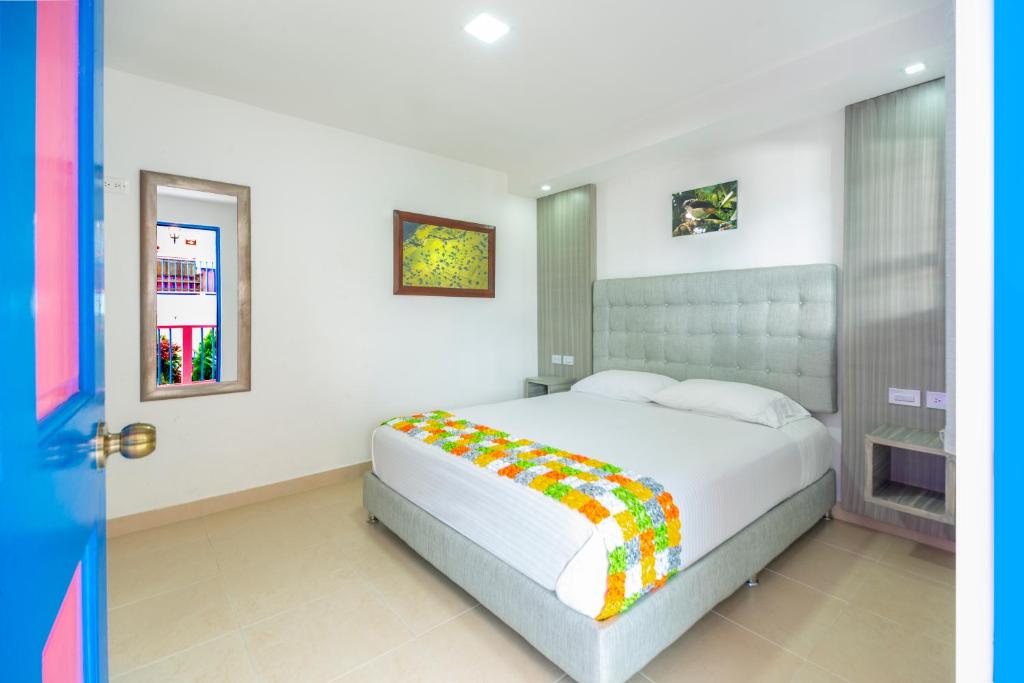 Postel nebo postele na pokoji v ubytování Hotel El Jardin