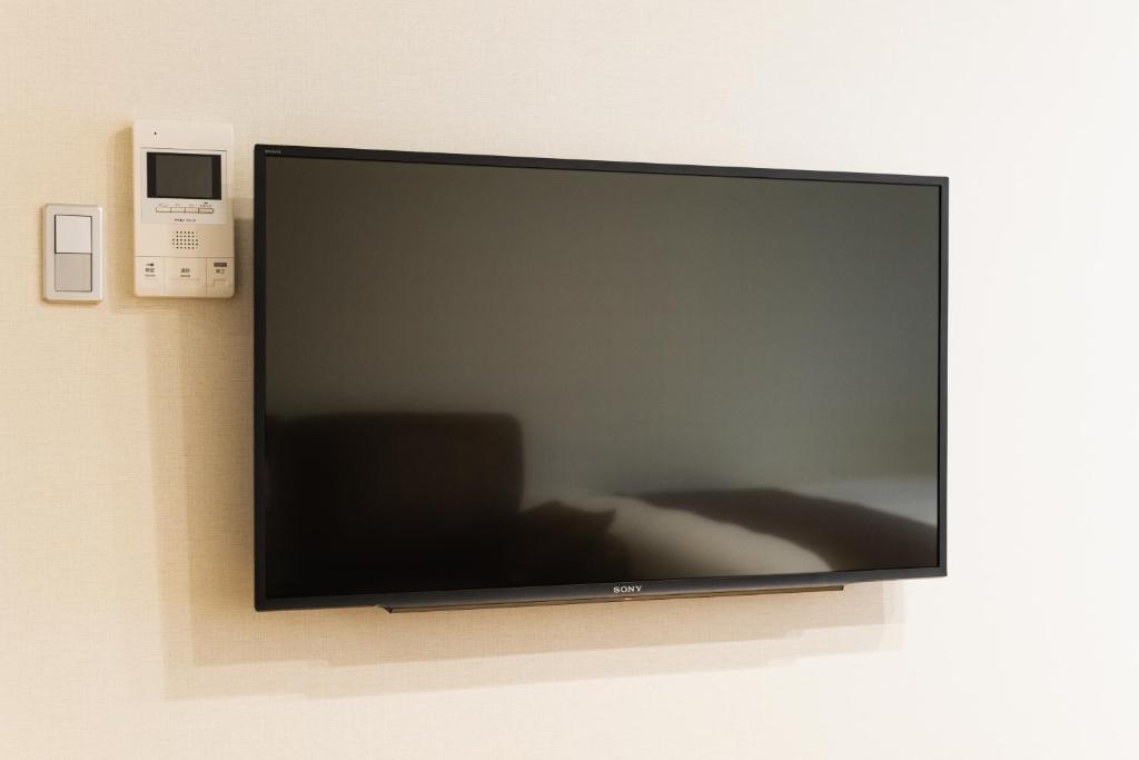 TV a/nebo společenská místnost v ubytování Cocolie BEPPU