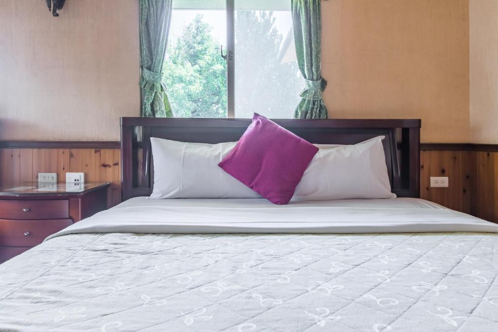 Postel nebo postele na pokoji v ubytování Kenting Maya-House B&B