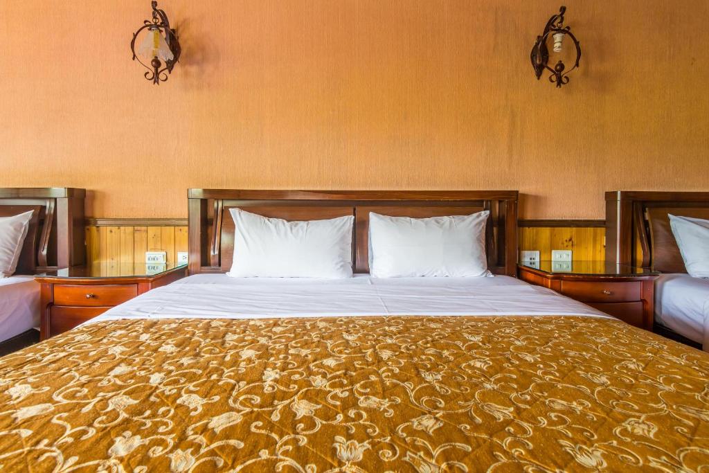 Postel nebo postele na pokoji v ubytování Kenting Maya-House B&B