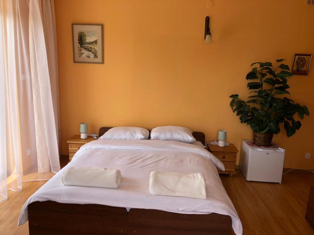 Posteľ alebo postele v izbe v ubytovaní Grand Panorama