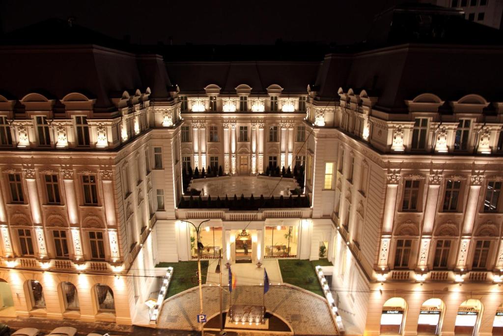 an aerial view of a building at night at Grand Hotel Continental in Bucharest