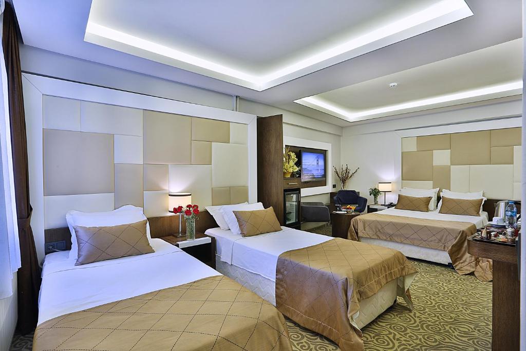 Postel nebo postele na pokoji v ubytování Grand Sagcanlar Hotel
