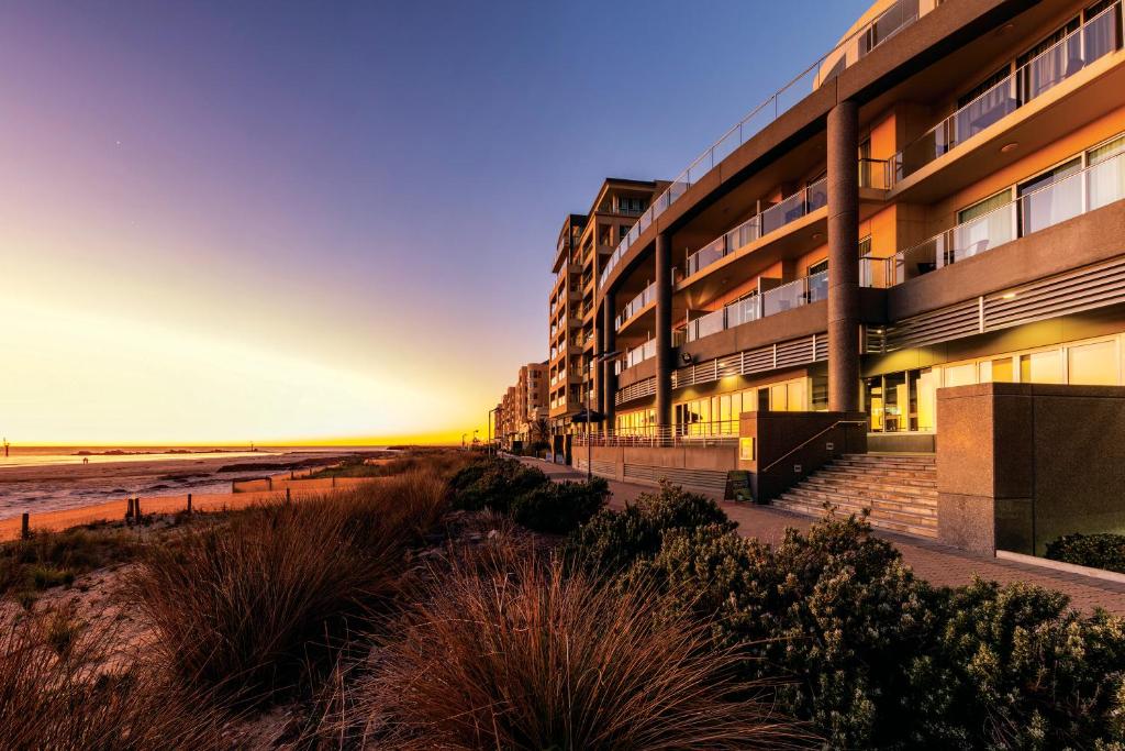 a beach with a view of the ocean at Apartments @ 16 Holdfast in Glenelg