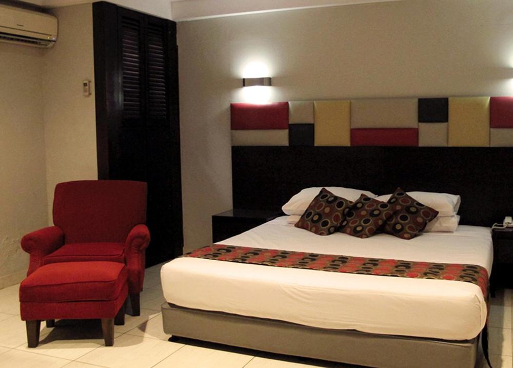 Postel nebo postele na pokoji v ubytování Hotel Alma