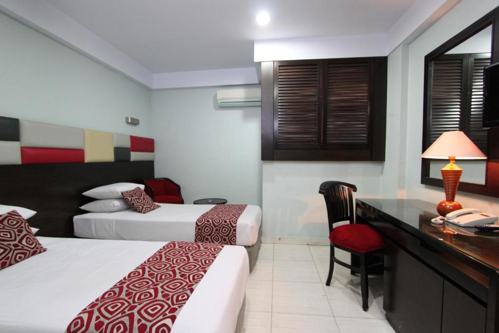 Postel nebo postele na pokoji v ubytování Hotel Alma