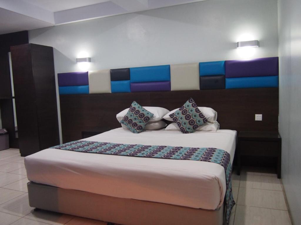 Postel nebo postele na pokoji v ubytování Hotel Alma