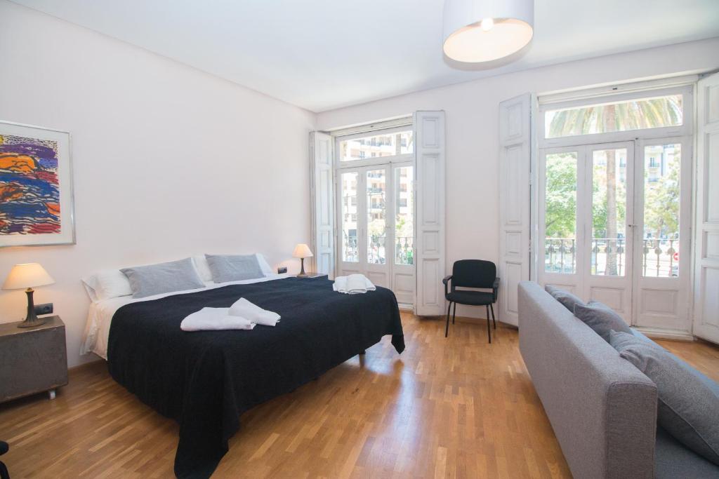 Säng eller sängar i ett rum på Bet Apartments - Canovas rooms