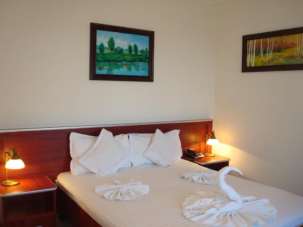 Postel nebo postele na pokoji v ubytování Hotel Ami