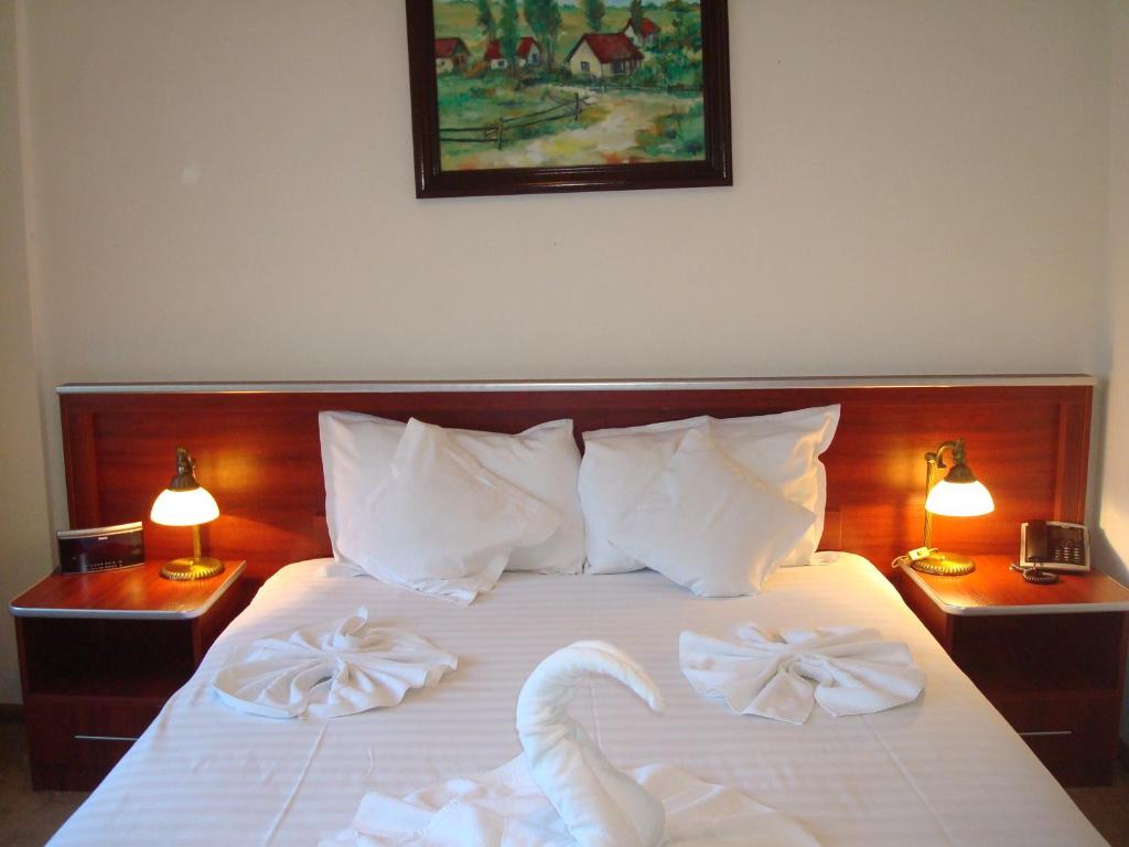 Postel nebo postele na pokoji v ubytování Hotel Ami