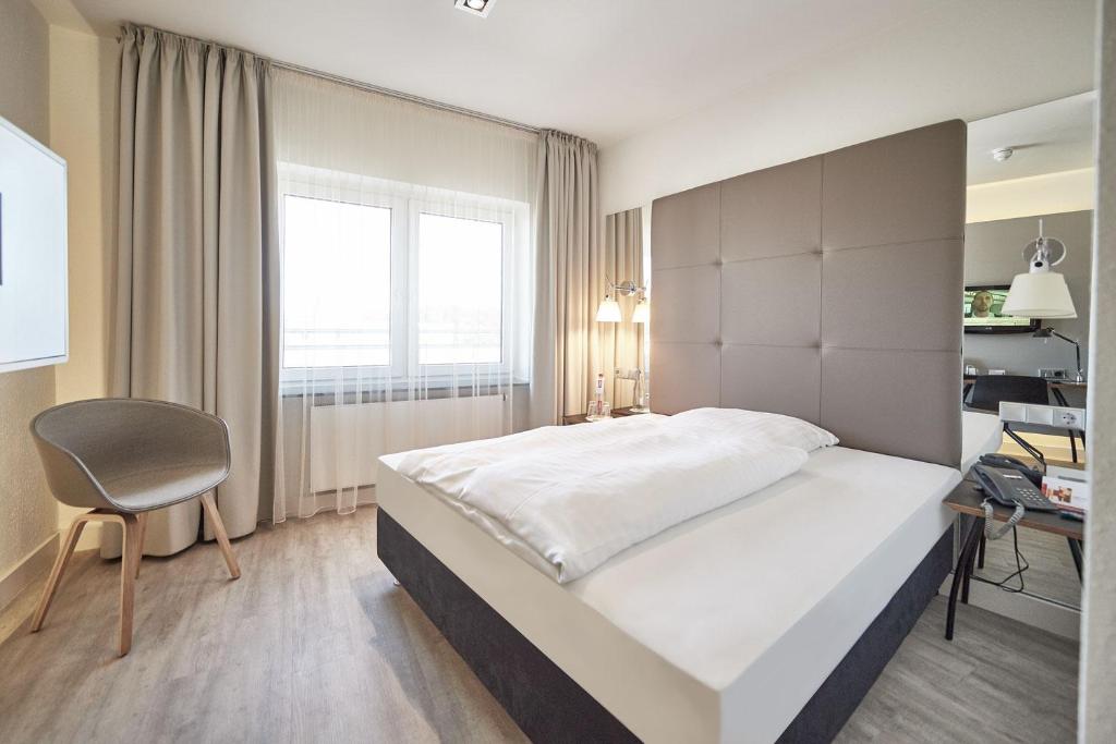 Postel nebo postele na pokoji v ubytování Hotel Amadeus