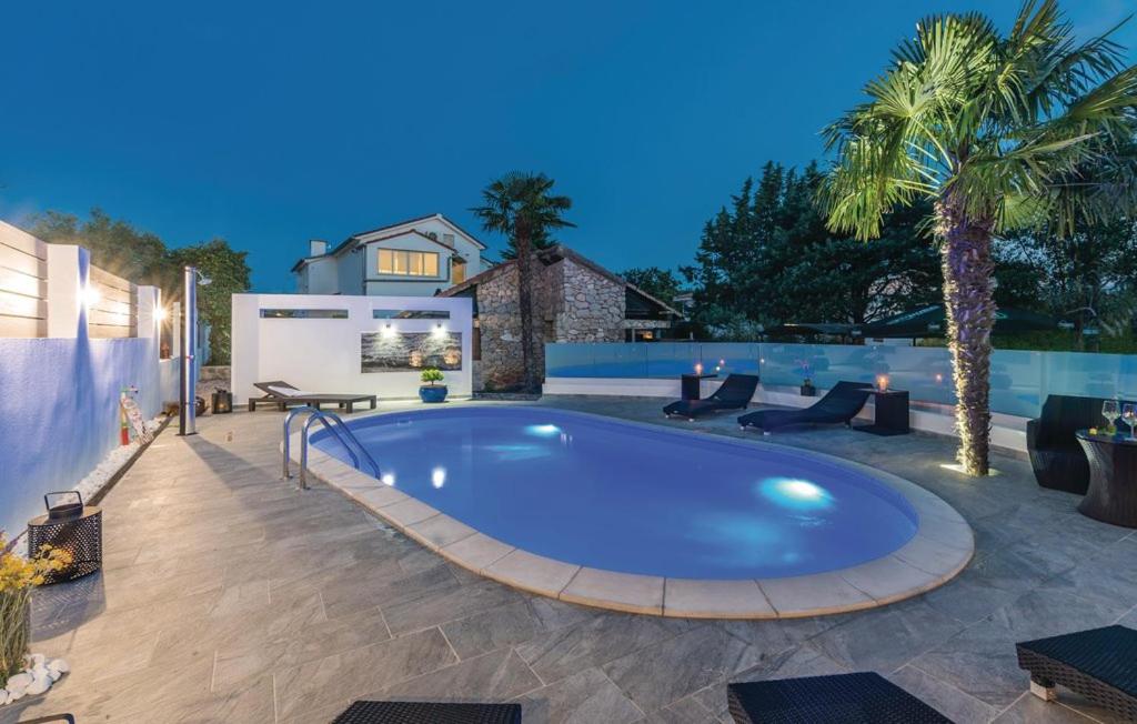 a swimming pool in a yard with a patio at Molnar Resort Villa Mimoza & Apartment Nea in Brzac