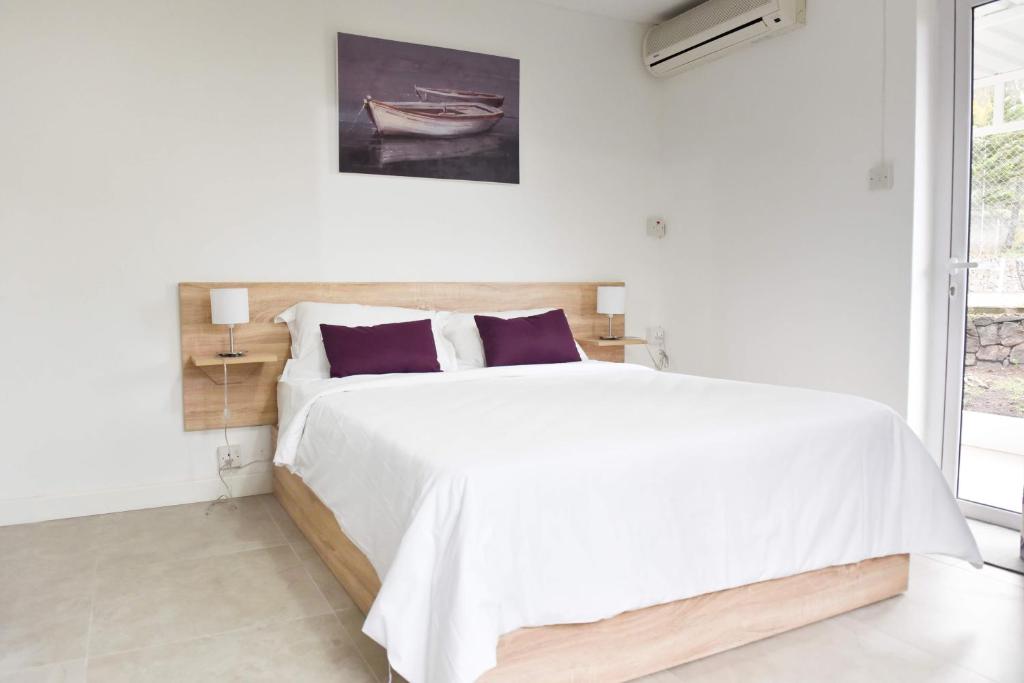 Voodi või voodid majutusasutuse Tamarin Chambres d'Hotes toas