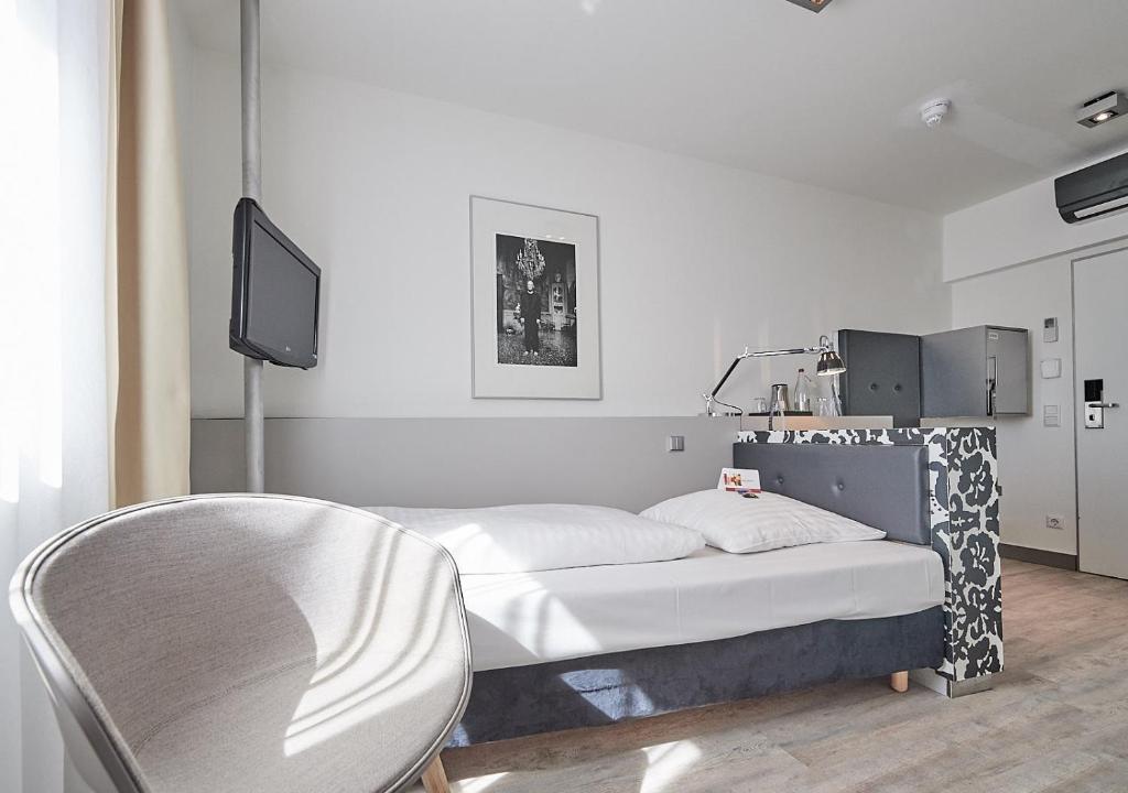 Postel nebo postele na pokoji v ubytování Hotel Amadeus