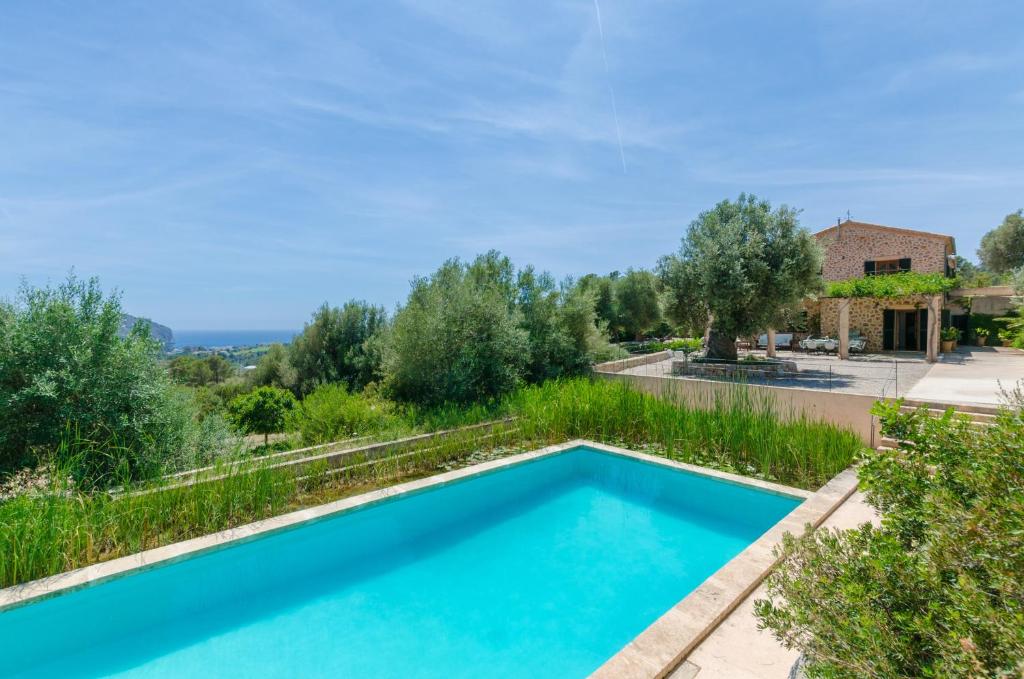 a swimming pool in the garden of a villa at Puig De Garrafa in Andratx