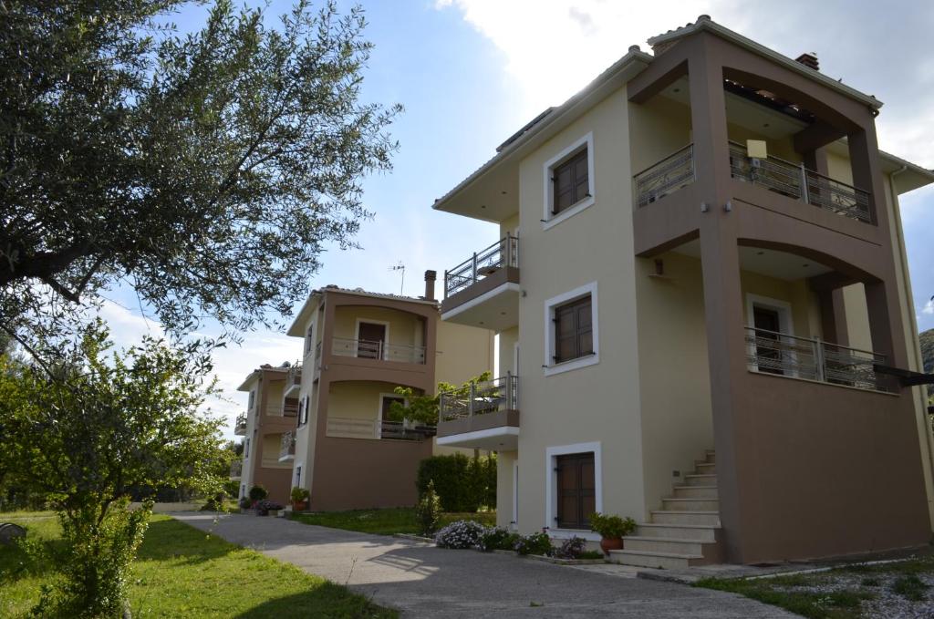 a building with balconies on the side of it at Agnanti Villas in Nafpaktos