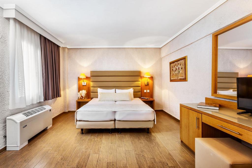 Postel nebo postele na pokoji v ubytování Poseidon Palace