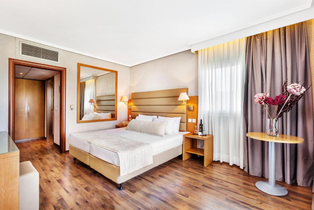 Postel nebo postele na pokoji v ubytování Poseidon Palace