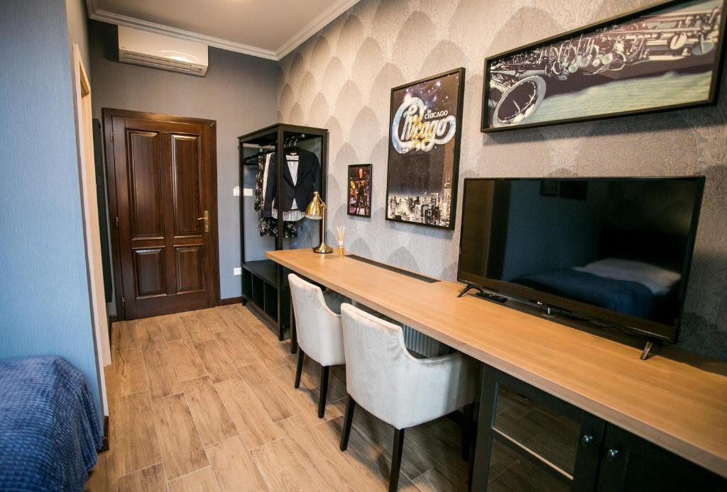 TV a/nebo společenská místnost v ubytování Chicago Vendégház
