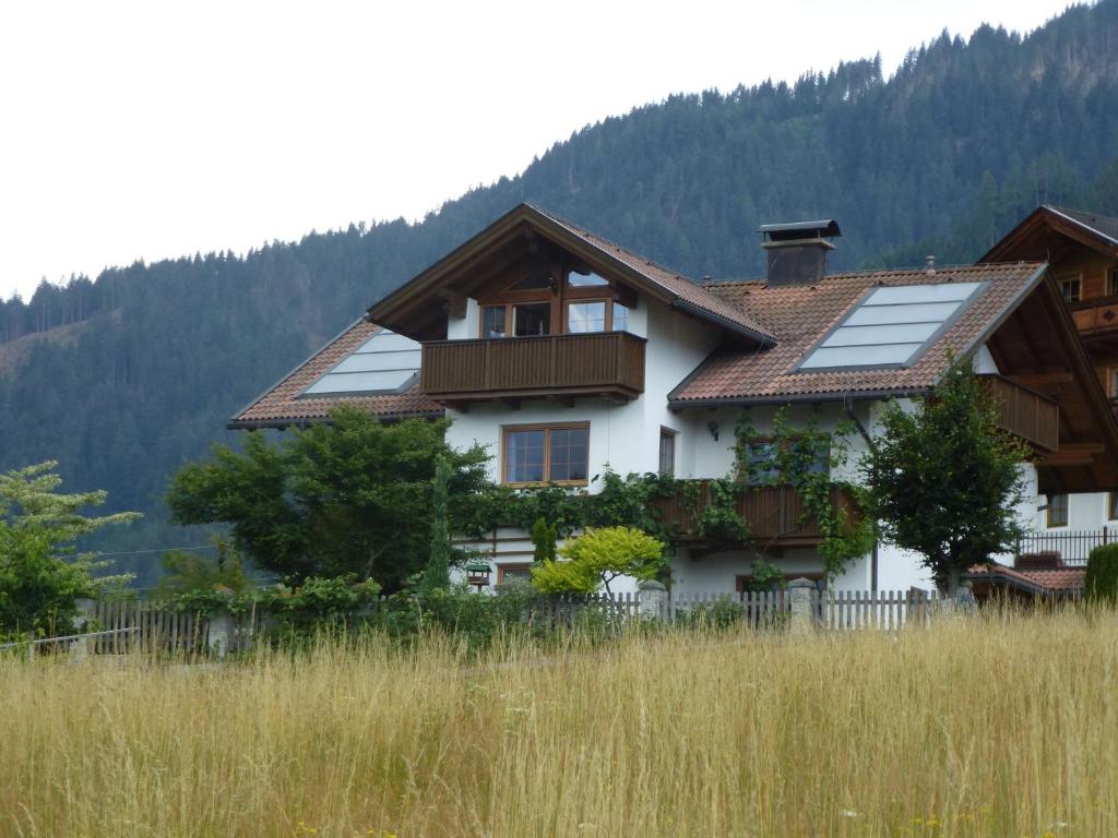 a house with solar panels on the roof at Ferienwohnung Mayr in Thurn