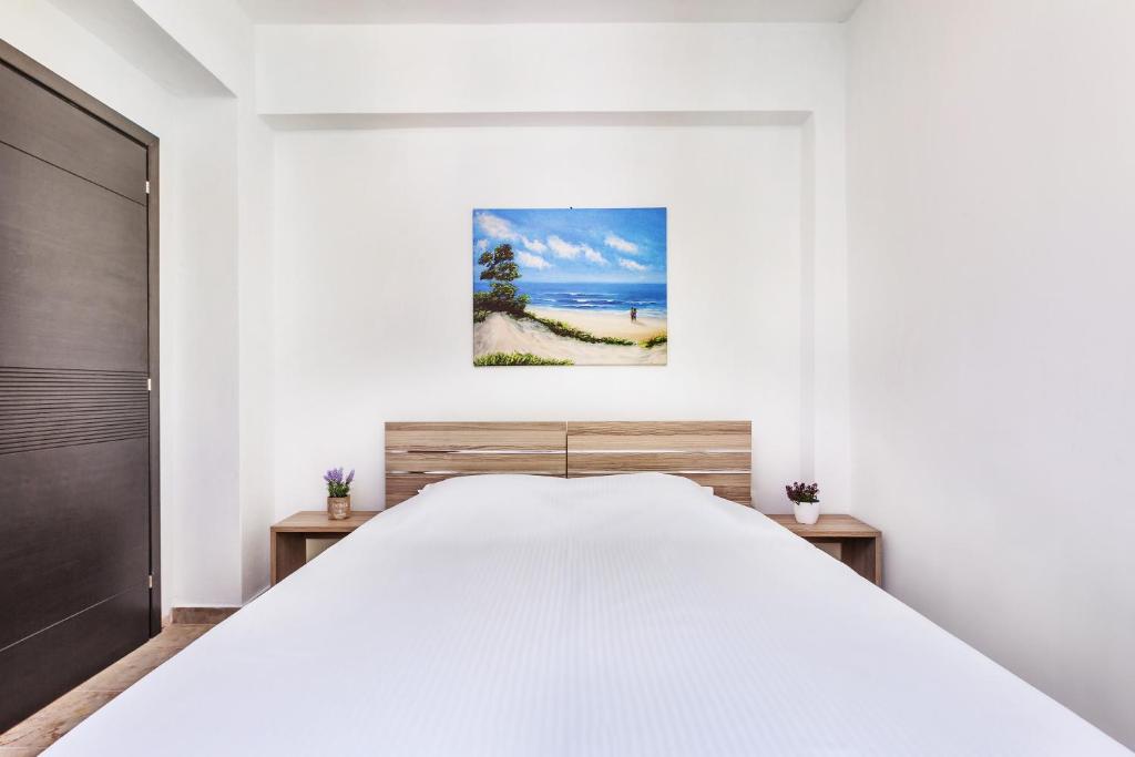 Postel nebo postele na pokoji v ubytování Sunset Villas