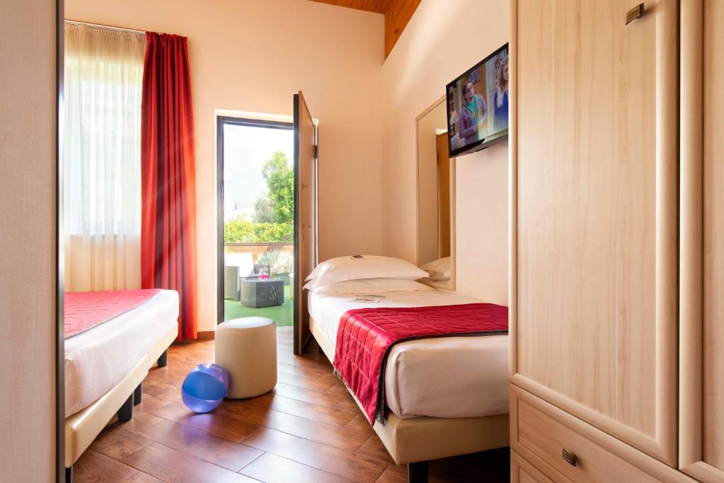 Postel nebo postele na pokoji v ubytování Simon Hotel
