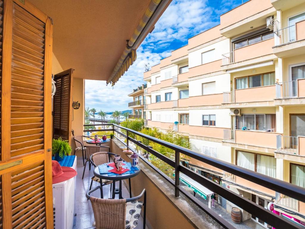 a balcony with tables and chairs on a balcony at Apartment Mariners 2 by Interhome in Alcudia